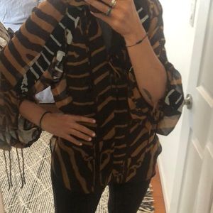 Sheer tie animal print top.